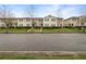 Charming townhouse showcasing lush green lawns, manicured bushes and a inviting exterior at 1613 Reflection Cv, St Cloud, FL 34771