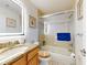 Bathroom with vanity and granite countertop plus shower and tub combo at 1705 S Atlantic Ave # 402, New Smyrna Beach, FL 32169