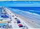 Capture the stunning beach from above, showcasing ocean views and beachgoers at 1705 S Atlantic Ave # 402, New Smyrna Beach, FL 32169