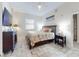 Comfortable bedroom with tv, dresser, and coastal-themed comforter at 1705 S Atlantic Ave # 402, New Smyrna Beach, FL 32169