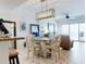 Bright dining area with stylish decor, a view of the ocean, and a breakfast bar that enhances the living experience at 1705 S Atlantic Ave # 402, New Smyrna Beach, FL 32169