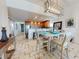 Charming dining area with an open floor plan and a view into the kitchen, creating an inclusive living space at 1705 S Atlantic Ave # 402, New Smyrna Beach, FL 32169