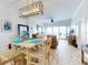 Bright dining area with ocean views, comfortable seating, and an open layout for easy entertaining at 1705 S Atlantic Ave # 402, New Smyrna Beach, FL 32169
