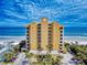 Stunning oceanfront building with private balconies and lush landscaping provides ultimate beachside living at 1705 S Atlantic Ave # 402, New Smyrna Beach, FL 32169