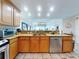 Bright kitchen with stainless steel appliances, tile backsplash, and stone countertops offers a modern look at 1705 S Atlantic Ave # 402, New Smyrna Beach, FL 32169