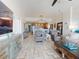 Open concept living and kitchen area with tile floors and ocean views at 1705 S Atlantic Ave # 402, New Smyrna Beach, FL 32169
