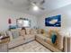 Comfortable living room with a sectional sofa, nautical decor, and decorative pillows, offering a cozy space at 1705 S Atlantic Ave # 402, New Smyrna Beach, FL 32169