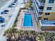 Aerial view of the pool and hot tub deck in a beachfront condo community at 1705 S Atlantic Ave # 402, New Smyrna Beach, FL 32169