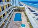 Aerial perspective of a pool and hot tub at a beachfront condo community at 1705 S Atlantic Ave # 402, New Smyrna Beach, FL 32169