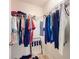 Organized walk-in closet with ample hanging space and storage solutions for clothing and accessories at 1705 S Atlantic Ave # 402, New Smyrna Beach, FL 32169