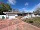 Charming single-story home features a brick facade, attached garage, and a well-maintained front yard at 1826 Giles St, Deltona, FL 32725