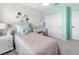 Bright bedroom featuring a cozy bed, stylish decor, and a functional built-in desk area at 1856 Cross Prairie Pkwy, Kissimmee, FL 34744