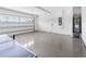 Well-lit two-car garage with epoxy flooring, and visible mechanics at 1856 Cross Prairie Pkwy, Kissimmee, FL 34744