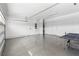Clean, organized two-car garage with smooth flooring and plenty of space for vehicles and storage at 1856 Cross Prairie Pkwy, Kissimmee, FL 34744