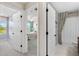 Hallway showcases multiple doorways leading to a bedroom, a bathroom, and another room at 1856 Cross Prairie Pkwy, Kissimmee, FL 34744