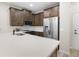 Modern kitchen featuring quartz countertops, stainless steel appliances, and tile backsplash at 1856 Cross Prairie Pkwy, Kissimmee, FL 34744