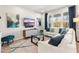 Comfortable living room with a sectional sofa, flat-screen TV, and stylish decor at 1856 Cross Prairie Pkwy, Kissimmee, FL 34744