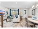 Bright living area featuring a sectional sofa, neutral walls, and stylish modern decor at 1856 Cross Prairie Pkwy, Kissimmee, FL 34744