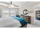 Sunlit main bedroom boasts a large window, stylish decor, and a calming ambiance at 1856 Cross Prairie Pkwy, Kissimmee, FL 34744