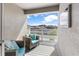 Relaxing porch with wicker furniture, outdoor television, and views of the neighborhood at 1856 Cross Prairie Pkwy, Kissimmee, FL 34744