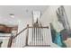 Carpeted staircase with white railings and wooden handrail leading to the upper level of the home at 1856 Cross Prairie Pkwy, Kissimmee, FL 34744