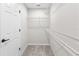 A well-organized walk-in closet with white shelving and ample storage space at 1856 Cross Prairie Pkwy, Kissimmee, FL 34744