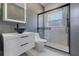 Modern bathroom featuring a glass-enclosed shower and stylish vanity at 1950 Windward Oaks Ct, Kissimmee, FL 34746