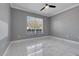 Bedroom featuring a window and tile flooring at 1950 Windward Oaks Ct, Kissimmee, FL 34746