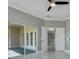 Bedroom showcasing a ceiling fan and sliding glass doors to the lanai at 1950 Windward Oaks Ct, Kissimmee, FL 34746