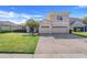 A well-maintained two-story home featuring a three-car garage and a paver driveway at 1950 Windward Oaks Ct, Kissimmee, FL 34746