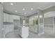 Stylish kitchen with island, stainless steel faucet, and white cabinets at 1950 Windward Oaks Ct, Kissimmee, FL 34746