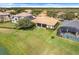 Scenic view of the lake with a long wooden boardwalk through the marshland, creating a tranquil atmosphere at 1950 Windward Oaks Ct, Kissimmee, FL 34746