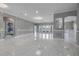 Spacious living room featuring white marble floors and decorative wall trim at 1950 Windward Oaks Ct, Kissimmee, FL 34746