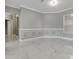 Bright living room features decorative wall trim and marble flooring at 1950 Windward Oaks Ct, Kissimmee, FL 34746