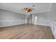 Large living room features decorative wainscoting and hardwood flooring at 1950 Windward Oaks Ct, Kissimmee, FL 34746
