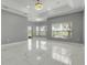 Relaxing living room features marble floors and backyard views at 1950 Windward Oaks Ct, Kissimmee, FL 34746