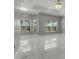 Inviting living room with marble flooring and scenic outdoor views at 1950 Windward Oaks Ct, Kissimmee, FL 34746