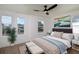 Cozy bedroom with neutral tones, hardwood flooring, and ample natural light at 1987 Peel Ave, Orlando, FL 32806