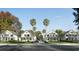 Street view of beautiful two-story homes with lush lawns and palm trees at 1987 Peel Ave, Orlando, FL 32806