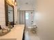 Bright bathroom with hexagon tile flooring, and rustic mirror detail at 2121 Knollview Ct, Oviedo, FL 32765