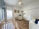 Bright Bedroom with wood floors, modern furnishings and ceiling fan at 2121 Knollview Ct, Oviedo, FL 32765