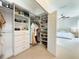 Walk-in closet featuring custom shelves, drawers, racks, and shoe storage at 2121 Knollview Ct, Oviedo, FL 32765