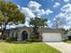 Charming single-story home with manicured lawn and a two-car garage at 2121 Knollview Ct, Oviedo, FL 32765