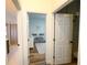 Hallway with open doorways leads to a well-decorated living space at 2121 Knollview Ct, Oviedo, FL 32765