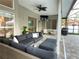 Covered patio with outdoor furniture, television, and a view of the screened in pool at 2121 Knollview Ct, Oviedo, FL 32765