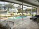 Screened in pool area featuring a heated pool and jacuzzi at 2121 Knollview Ct, Oviedo, FL 32765