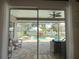 View of the screened in pool area with lounge seating and umbrella at 2121 Knollview Ct, Oviedo, FL 32765