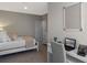 Comfortable bedroom with a double bed, desk, and storage, providing a practical and restful environment at 2140 Monteverde Ave, Davenport, FL 33896