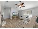 Bright living room featuring hardwood floors, ceiling fan and modern furniture at 2469 Dartmouth Rd, Deland, FL 32724