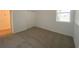 Well-lit bedroom with closet and carpet flooring at 2668 Spider Lily Ct, Clermont, FL 34711